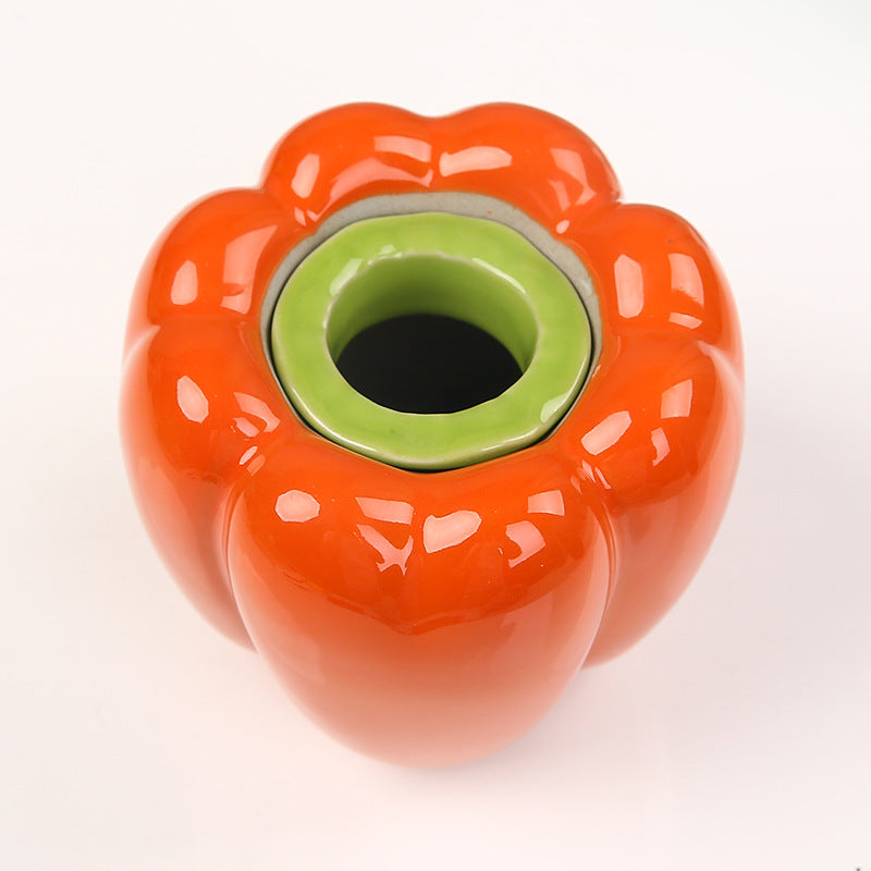 Top view of ceramic bell pepper planter — shows wide mouth opening for water propagation